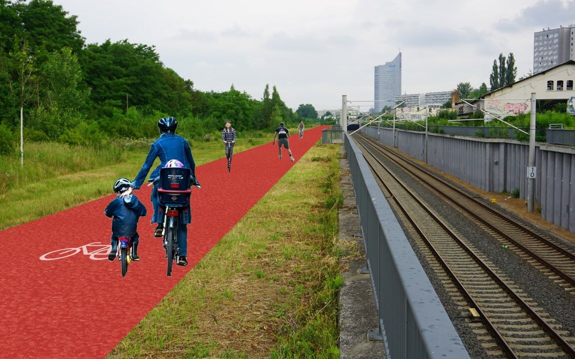 Blick auf Fotomontage, Bahngelände am Bayrischen Bahnhof, im Hintergrund der Uni-Riese, im Vordergrund Radfahrer auf einem roten Radweg
